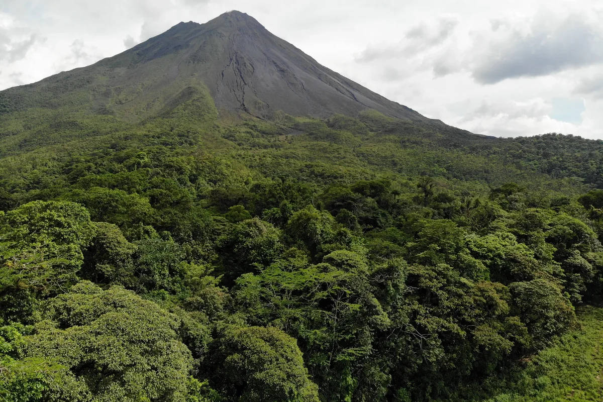 Rainforest-cloaked Arenal Volcano from above. Photo: Joshua ten Brink / WildPhotography.com